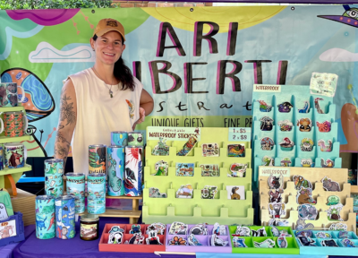 Ari posing at her booth during the Haile's Farmers Market