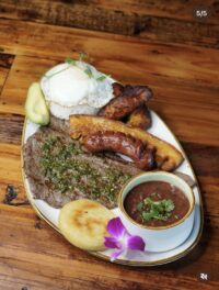 A big dish with meat, beans and pork