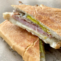 A close up photo of a cuban sandwich